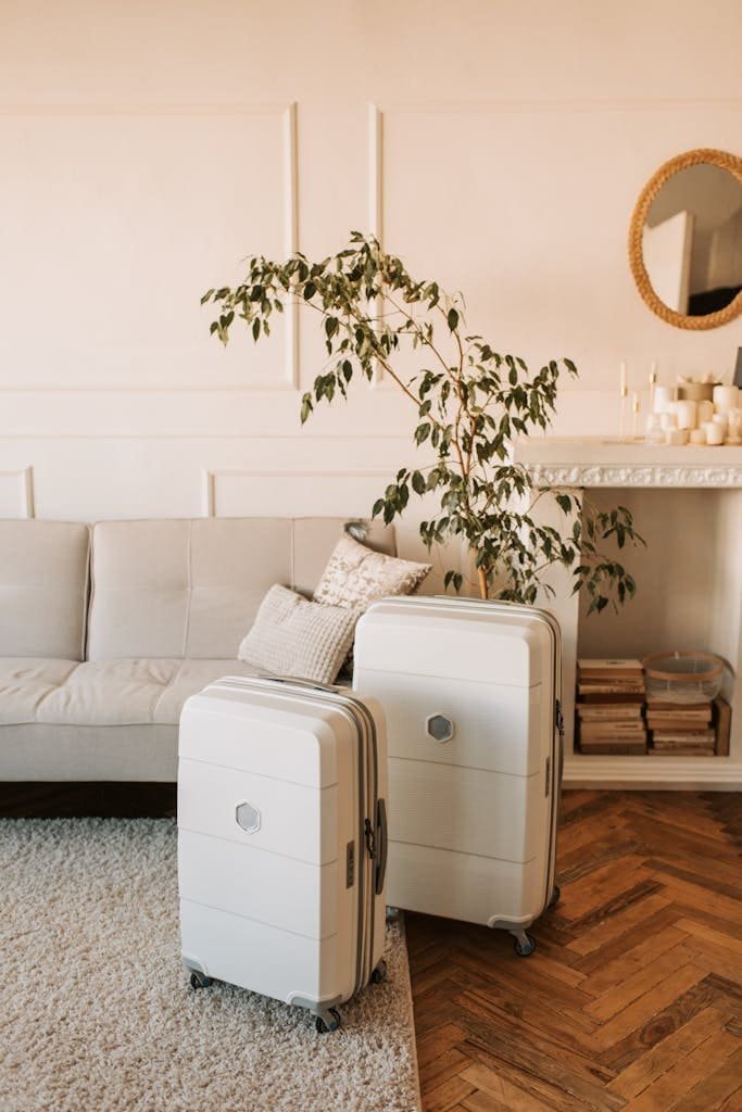 A stylish living room with packed luggage, ready for a travel adventure.