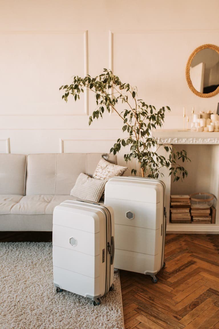 A stylish living room with packed luggage, ready for a travel adventure.